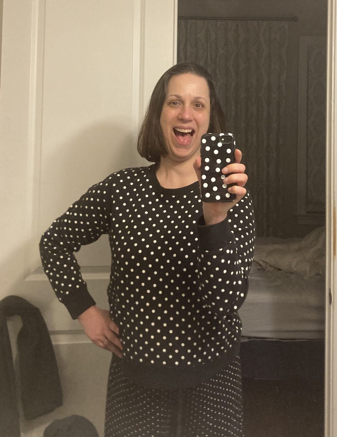 Rebecca mirror selfie-ing to show off her polka dots